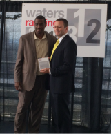 Bloomberg PolarLake CEO John Randles receives Waters Technology award in New York. Pictured with retired baseball star Doc Gooden.