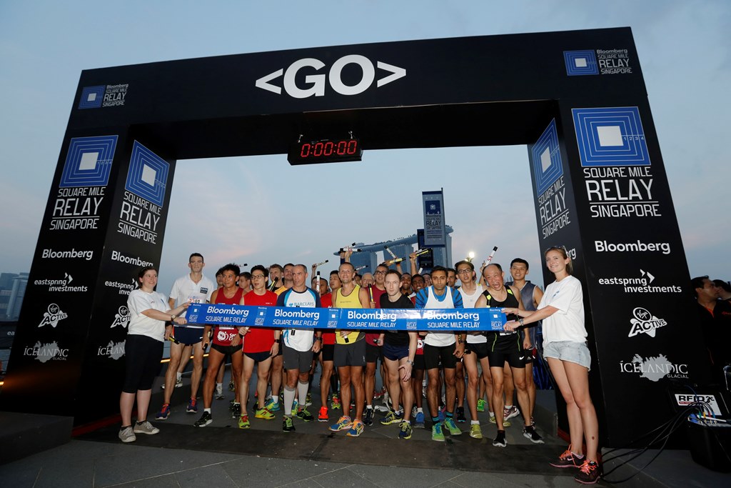 Competitors line up for the start of the 2014 Bloomberg Square Mile Relay in Singapore.