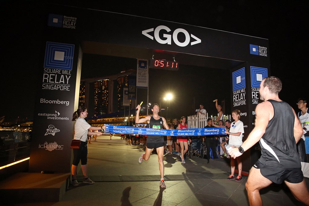 The team from Macquarie crosses the line to win the Bloomberg Square Mile Relay Singapore 2014.