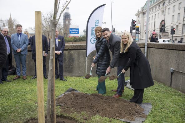 Patti Harris, Chris Harper-Harris, and Jemma Read help plant the millionth tree