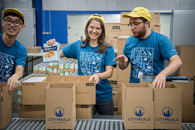 Bloomberg interns packed 7,502 meals to be distributed among the community