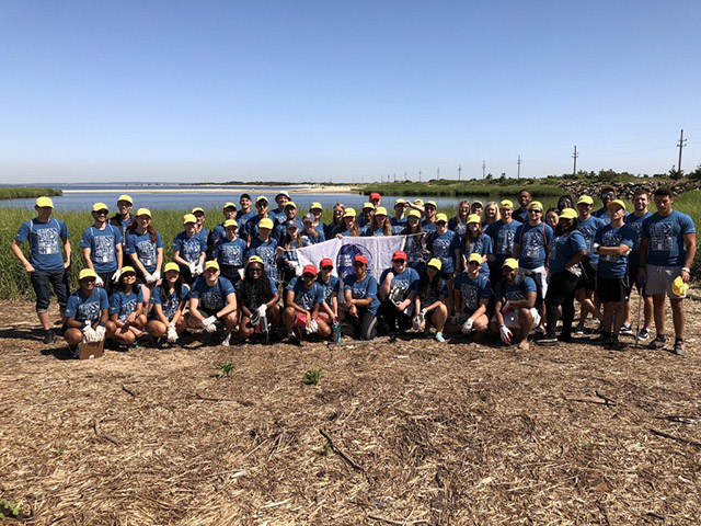 Bloomberg interns helped clean up trash along the Sandy Hook coastline