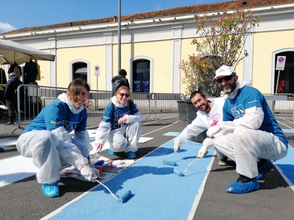 Employees Paola Buscemi, Lorena Ferrari and Giovanni Latella joined Bloomberg Associates and local volunteers to help the City of Milan paint a new pedestrian plaza