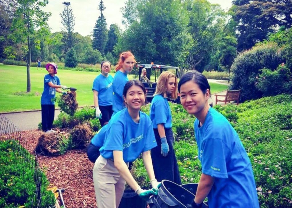 Attendees volunteering to pick up litter at the Royal Botanic Gardens as part of Bloomberg Philanthropies Best of Bloomberg program
